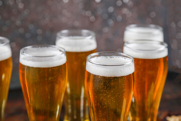 Beer glasses with different snacks.