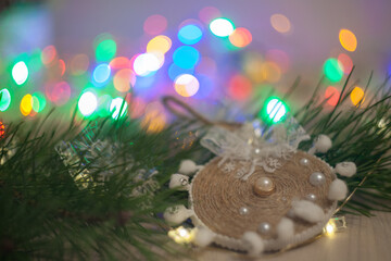 Christmas tree branch with vintage decor and garland lights. New Year's atmosphere.
