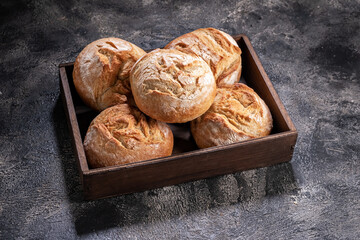 buns in a box on a wooden table