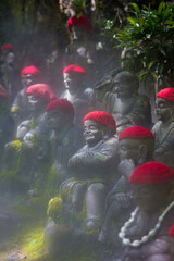 little buddha statues in a temple in the island of Myiajima in japan
