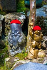 little buddha statues in a temple in the island of Myiajima in japan