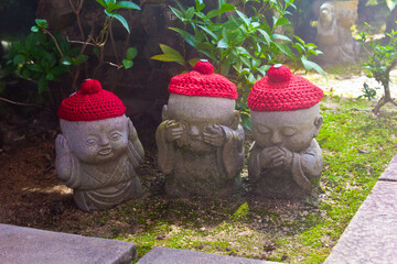 three buddah statues with ears mouth and eyes shuts
