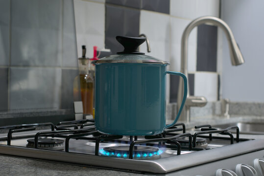 Warmth in a Mug: Flame-Lit Blue Elegance