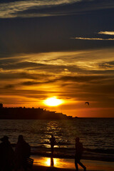 Sunset on the beach of Mazatlán Sinaloa with people walking