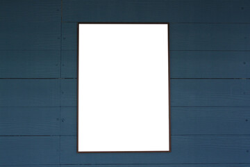 Empty picture frames on a dark wooden blue wall.