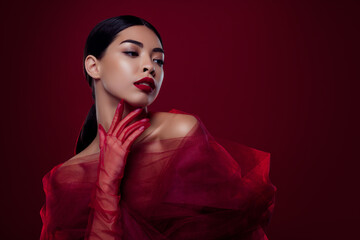 Photo of asian young woman femme fatale touch neck tease sexual desire shoulders off isolated dark...