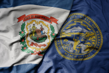 big waving colorful national flag of nebraska state and flag of west virginia state .