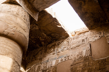 light pouring into ancient hallway in Karnak Temple in Luxor Egypt