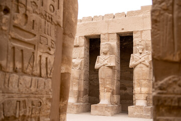 Fototapeta premium series of pharoahic statues in hallway of Karnak Temple in Luxor Egypt