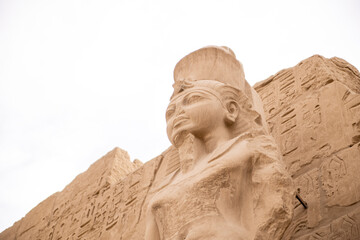 ancient ruined statues in Karnak Temple in Luxor Egypt