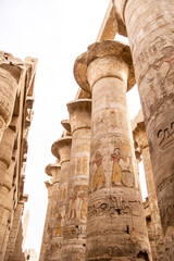 ancient Egyptian hieroglyphs on massive columns of hippostyle hall in karnak temple in luxor, egypt