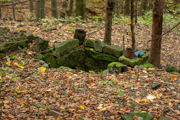 Old stone well outdoors in nature.