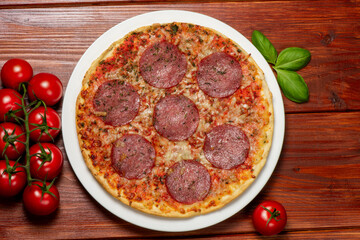 Pizza with salami. Rustic style