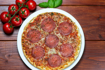 Pizza with salami. Rustic style