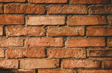 Red bricks on the wall. Wall texture on the building.