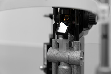 ophthalmic equipment placed in light contemporary optical shop for checking vision, slit lamp examination, ophthalmology concept, Slit lamp. Biomicroscope. Binoculars.