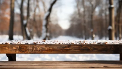 Fotobehang Snowy wooden table with blurred forest backdrop perfect for product placement. 16k super quality. © Ilja
