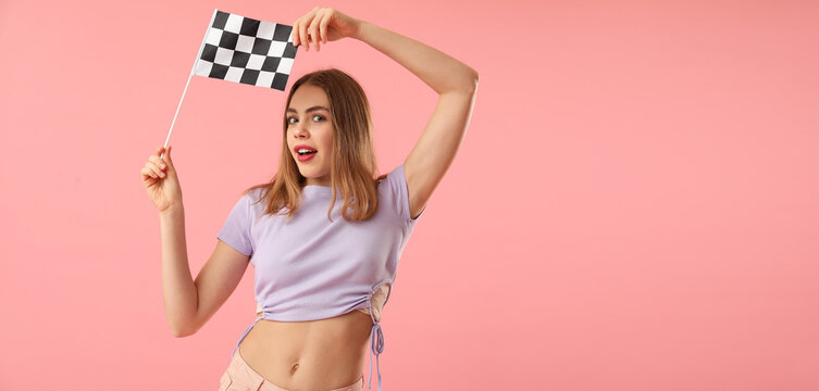 Pretty young woman holding racing flag on pink background with space for text
