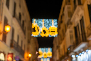Blurry christmas decorations on city center in Malaga, Spain