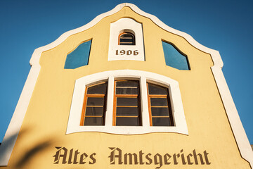 The fa?ade of Altes Amtsgericht (Old Magistrate Court) Building in Swakopmund, Namibia. The German words on the fa?ade translate to ?Old Magistrate Court?. - obrazy, fototapety, plakaty
