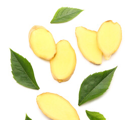 Slices of fresh ginger root and leaves on white background