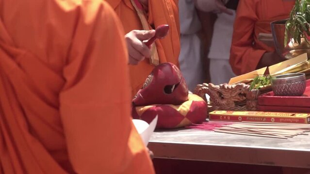 Chinese Buddhist monks engaged in a chanting ritual 