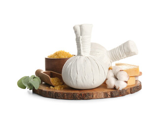 Wooden board with spa herbal bags, sea salt and soap on white background