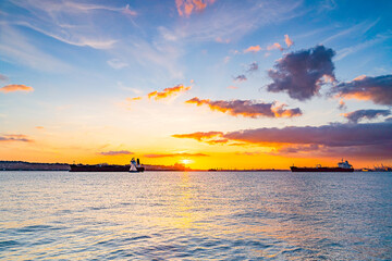 Beautiful waterfront, sky and clouds during sunset, view on Gravesend Bay in Brooklyn , New York