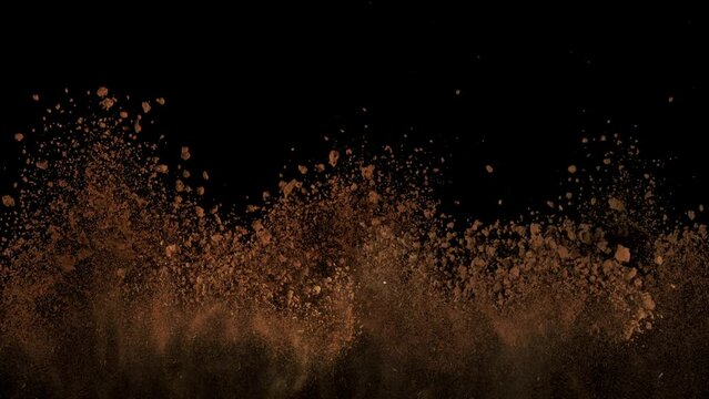 Super Slow Motion Shot of Soil Explosion Isolated on Black Background at 1000fps.