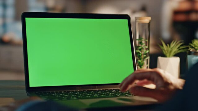 Manager fingers scrolling chromakey laptop touchpad working night home closeup