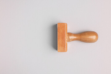One wooden stamp tool on light grey background, top view. Space for text