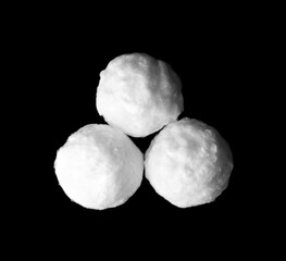 Balls of clean cotton wool on dark background, flat lay