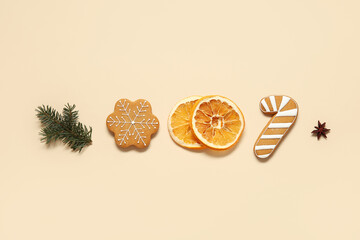 Tasty Christmas cookies with decor on beige background