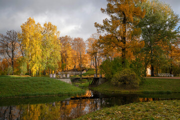 View of the bridge over the Upper Ponds in the Catherine Park of Tsarskoye Selo on a sunny autumn...