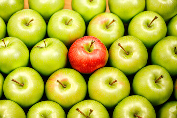 Red apple surrounded by green apples