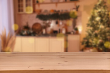 Wooden table in room decorated for Christmas. Space for design