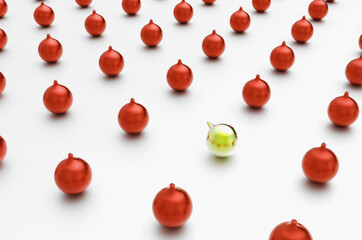 Christmas balls on a white background with a gold one in perspective