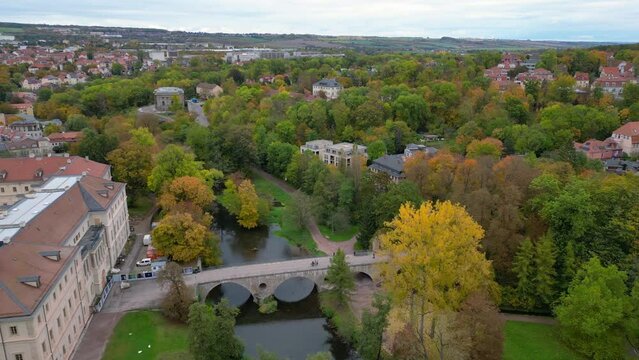Bridge over ilm Great aerial top view flight 
Weimar old town cultural city Thuringia germany fall 23. rotation to right drone
4k footage