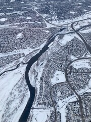 Aerial view of snowy city bisected by river