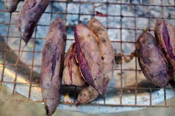 Grill sweet potato on barbecue grill at street market

