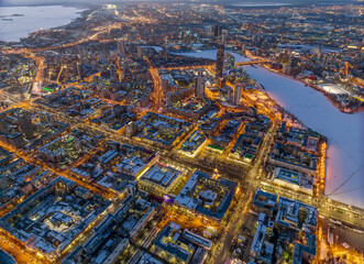 Naklejka premium Embankment of the central pond and Plotinka in Yekaterinburg at winter sunset. The historic center of the city of Yekaterinburg, Russia, Aerial View