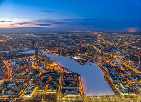 Embankment of the central pond and Plotinka in Yekaterinburg at winter sunset. The historic center of the city of Yekaterinburg, Russia, Aerial View