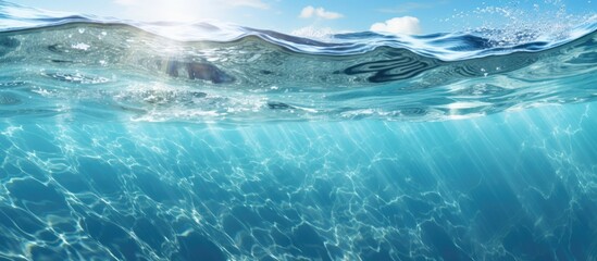 Obraz premium The sunlight reflected off the calm surface of the glassy ocean creating an abstract texture that was both mesmerizing and serene as I gazed up close at the captivating marine nature of the