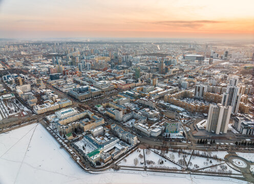 Embankment of the central pond and Plotinka in Yekaterinburg at winter sunset. The historic center of the city of Yekaterinburg, Russia, Aerial View