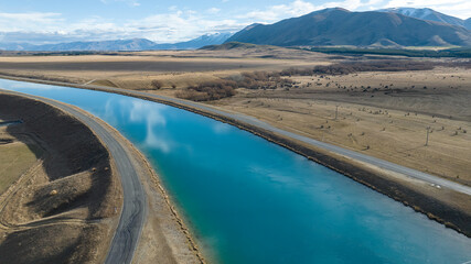 Aerial view of the Pukaki hydro power scheme canal in rural Twizel running in parallel with the now...