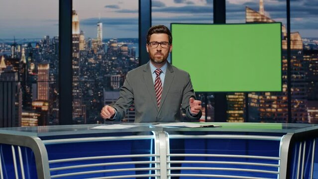 Reporter man talking chromakey screen at studio. Presenter reporting live news