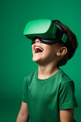 Naklejka premium Young boy getting experience using VR headset glasses isolated on a green background