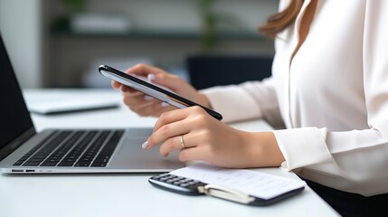 Fototapeta premium Close up view of woman using smartphone in front of laptop at office desk. White empty screen for app or web site design : Generative AI