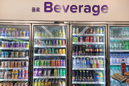 PENANG, MALAYSIA - 26 SEP 2023: A large fridge at CU Convenience Store offers a diverse selection of beverages. CU is a South Korean convenience store chain that is operated and owned by BGF Retail.