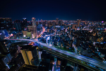 Fototapeta premium A night panoramic cityscape in Osaka high angle wide shot